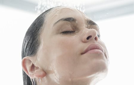 Woman taking shower.